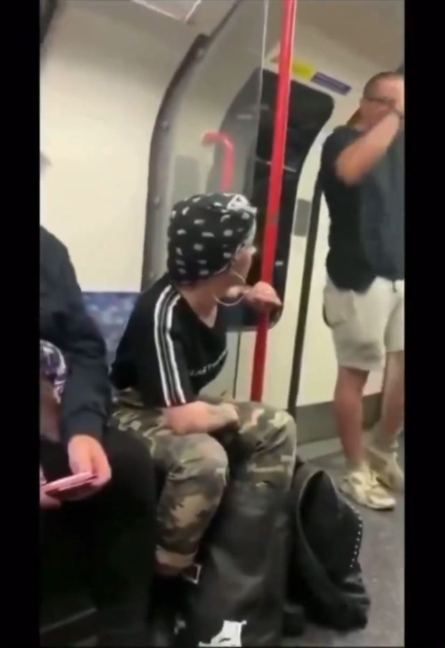 Dude gets dropped on the subway for being racist